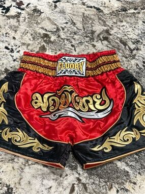 Men’s Red and Black Muay Thai Shorts with Gold Accents